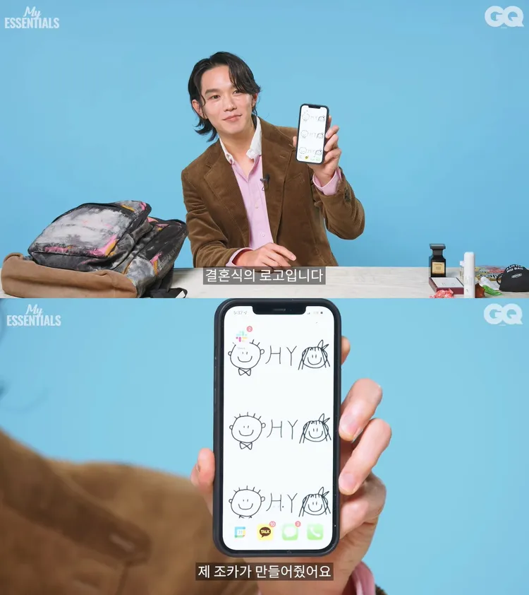 凱文吳秀出手機背景畫面，是姪子繪畫的夫妻Q版人像，也是婚禮的logo。翻攝YouTube