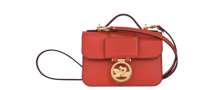 Box-Trot系列橘色迷你款手提斜背包，2萬800元。品牌提供