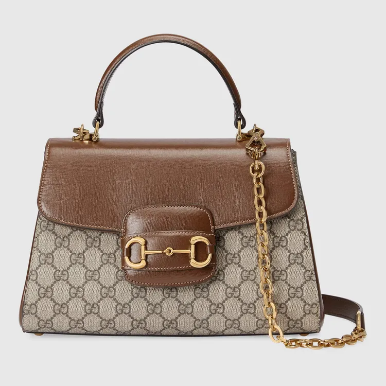 Gucci Horsebit 1955中號棕色皮革手提肩背包，10萬800元。品牌提供