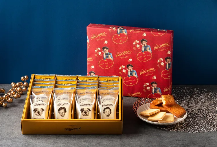 The Maple Mania 楓糖男孩新春禮盒」28入，含楓糖奶油夾心餅乾20入與楓糖費南雪8入，售價1,380元。業者提供