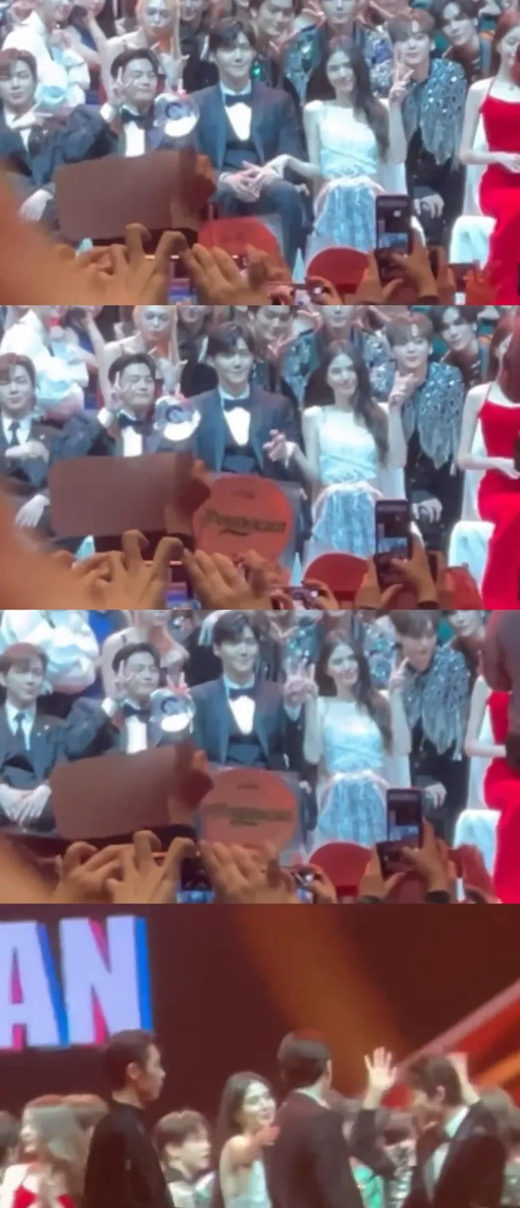 韓素希見金宣虎沒比動作，拉起他的手示意比YA，最後輕拍他的背打氣。翻攝推特