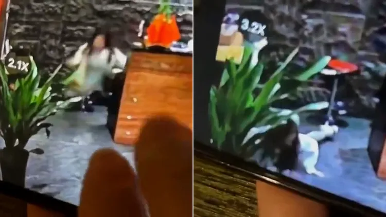 女服務員要救援客人時，自己卻也摔倒在地。翻攝自微博