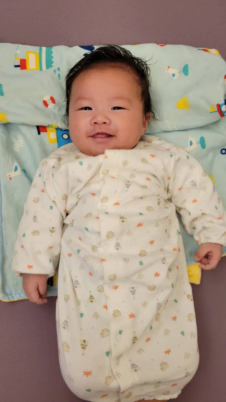 俊俊才兩個月大就會開心地笑。葉文正攝