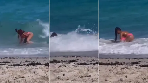 比基尼辣妹海灘自拍 浪濤不賞臉!把她KO還將泳衣脫了