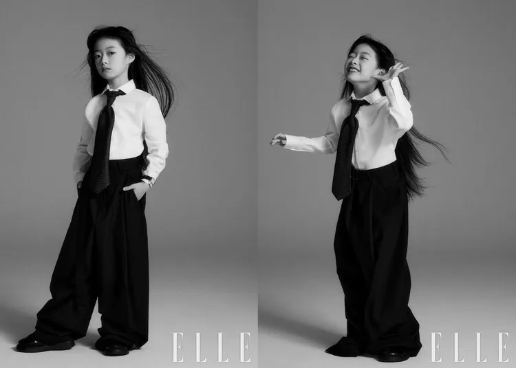 她穿上白襯衫、寬版西裝褲「裝大人」的樣貌俏皮又可愛。翻攝ellekorea IG