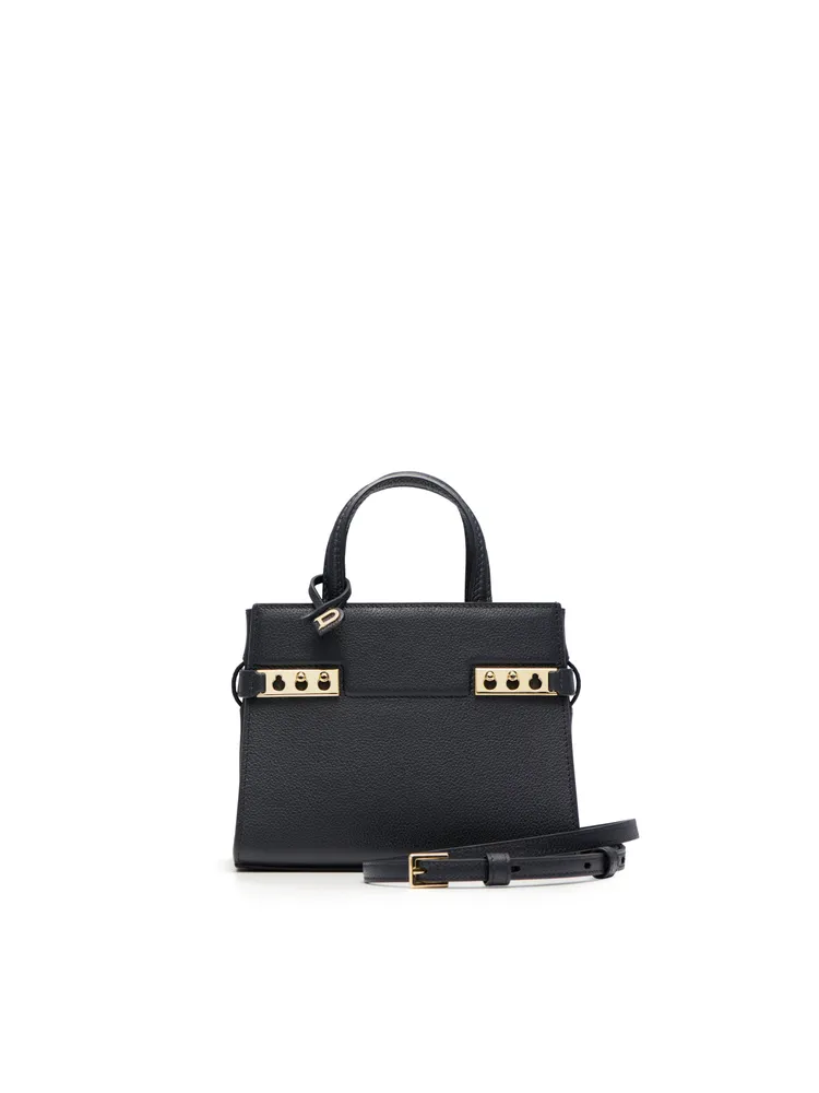 DELVAUX Tempête Crush黑色手袋，12萬7900元。品牌提供