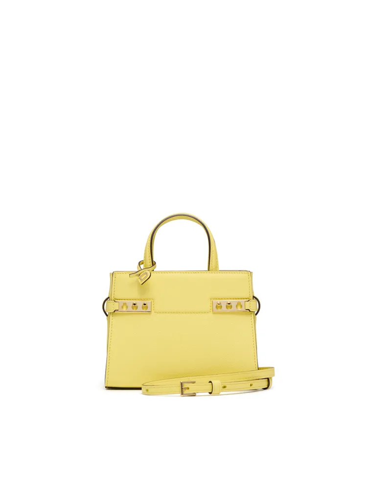 DELVAUX Tempête Crush雪酪黃手袋，12萬7900元。品牌提供