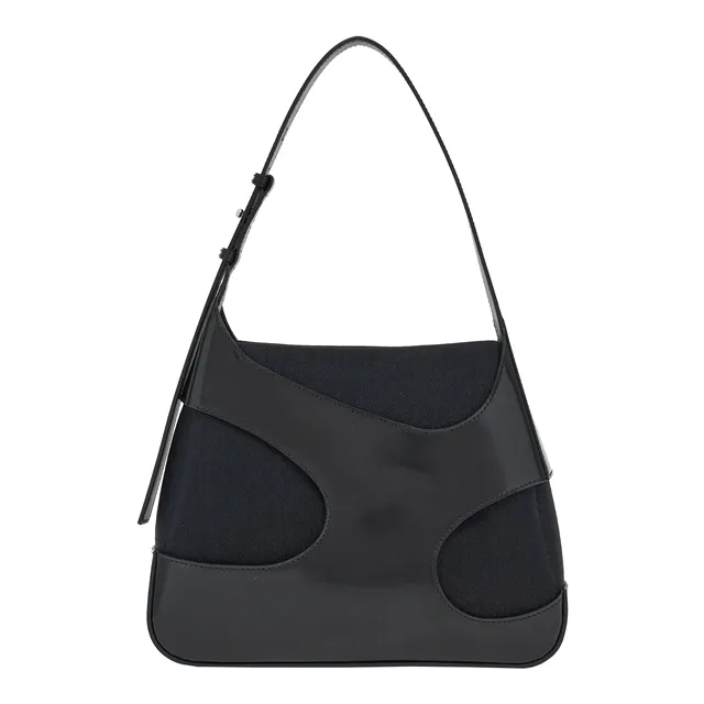 大型鏤空剪裁黑色皮革黑色帆布手提包，8萬1900元。品牌提供