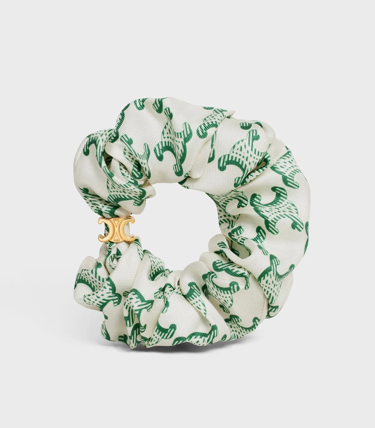 金色飾面Triomphe徽誌絲質髮飾,9700元。品牌提供