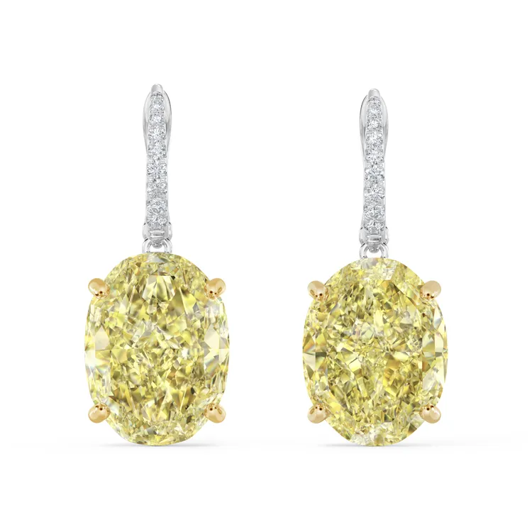 DB Classic橢圓形切割黃鑽垂墜式18K金鑲鑽耳環，各擁10.01、10.32克拉橢圓形切割黃鑽，濃彩耀眼，約4735萬元。品牌提供