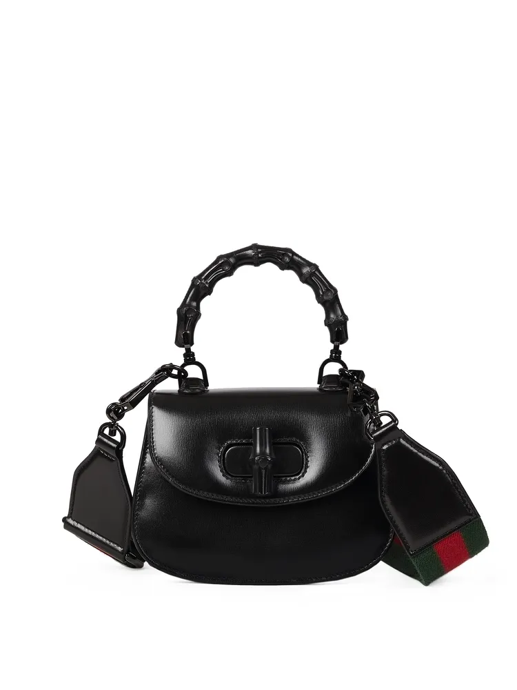 GUCCI Bamboo 1947系列黑色迷你手提肩背包，13萬1700元。品牌提供