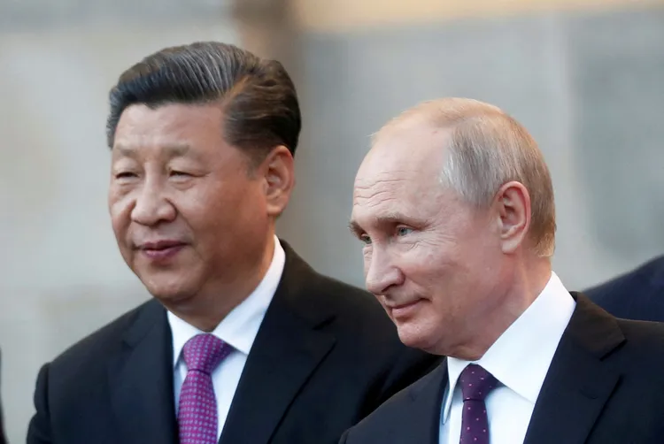 習近平（左）與俄羅斯總統普丁的交流友好熱絡。資料照片