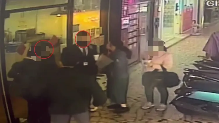 被害吳女與王、高2嫌(紅圈處)從早餐店出來後埋伏警員立刻上前逮人。板橋警分局提供