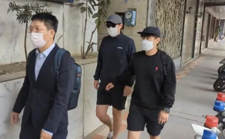 金姓男子（戴墨鏡者）日前以10萬元交保、限制出境8個月。讀者提供