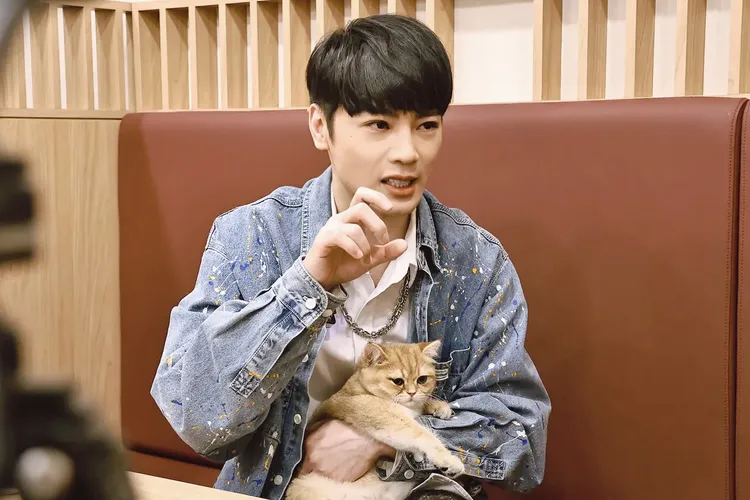 古曜威分享照顧KUDI甘苦。施昂強攝