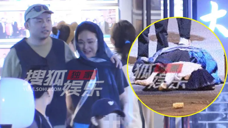 周迅大方讓卓越攬肩，後來她在路上跟小女孩一起行跪拜禮。翻攝搜狐娛樂