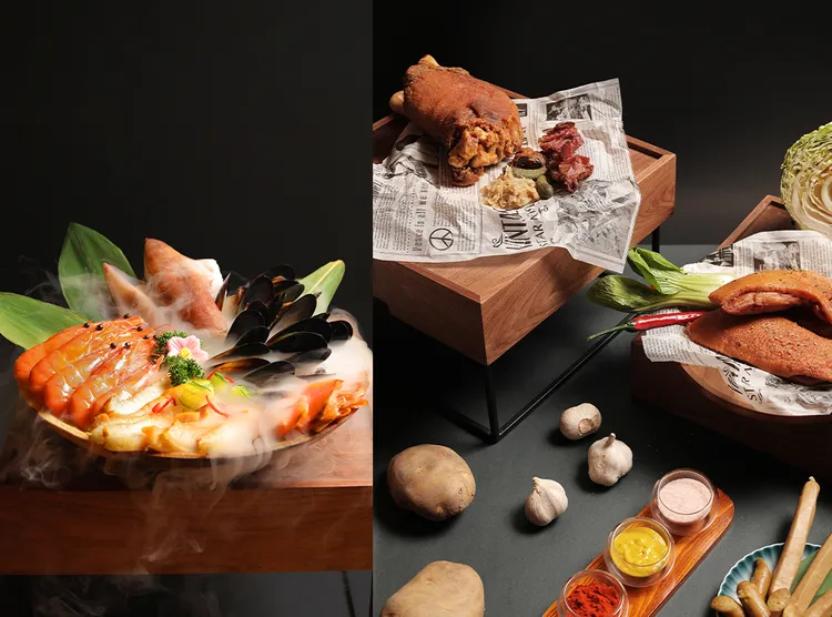 「日料海鮮」區必嚐現流海鮮，嚴選市集直送的鮮蝦、貽貝、燻鮭魚片、透抽等鮮美海味輪番上陣；饕客欽點「經典肉品」區的必吃雙寶，首推焦糖色澤的煙燻鴨胸，和還原德國經典的脆皮豬腳。業者提供