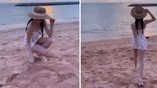 這是一位海灘正妹　但她看來已經有人陪