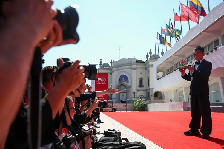 梁朝偉成為鎂光燈焦點。路透社