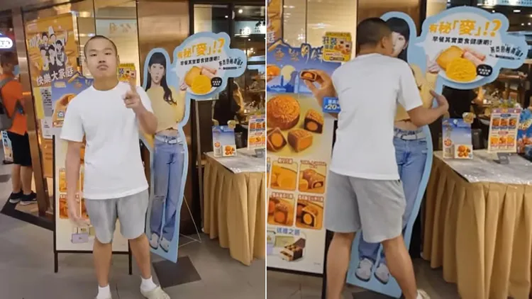 光頭Bob對炎明熹的看板做出猥褻行為。翻攝自臉書