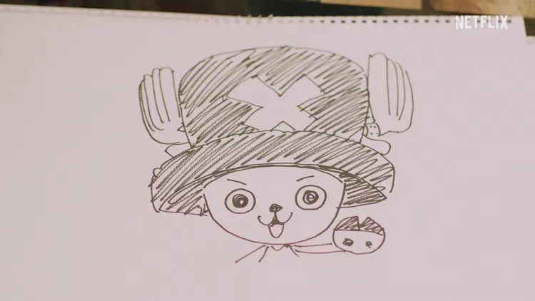 尾田榮一郎表示草帽海賊團需要一名「優秀的醫生」，接著畫下喬巴的模樣，暗示喬巴將在第2季登場。翻攝Netflix YouTube