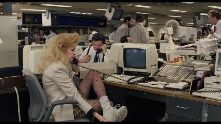 1988年推出的電影《上班女郎》劇照。(Photo Credit: 20th Century Studios) (圖片出處：https://www.filmaffinity.com)