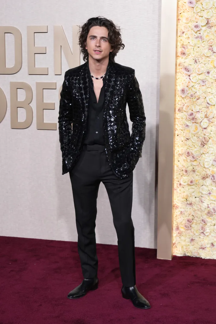 提摩西夏勒梅一身黑。美聯社