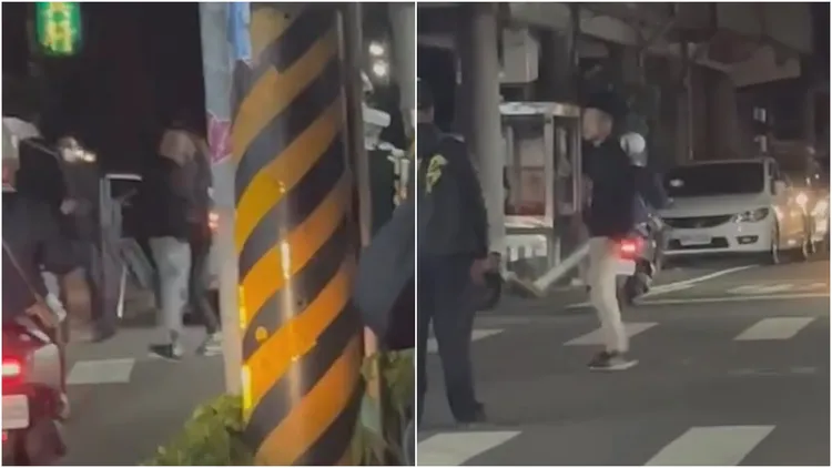 黑衣男亮出西瓜刀，踏「六親不認步伐」叫囂示威。翻攝自臉書「爆廢1公社」