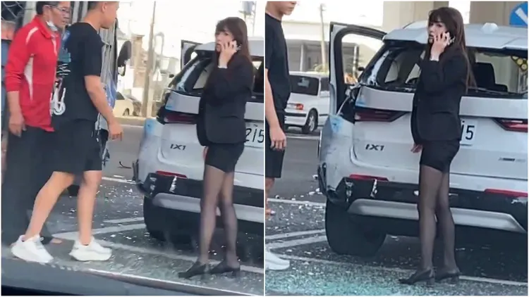車禍現場驚魂未定的BMW黑絲正妹業務員，急忙撥電話聯繫處理車禍事宜。翻攝自臉書「爆廢1公社」