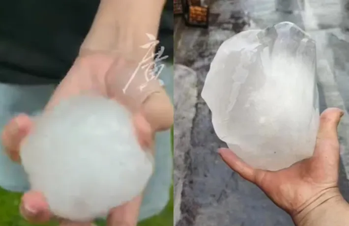 廣州市民眾撿起比拳頭大的「殺人冰雹」。翻攝微博/廣州市白雲區