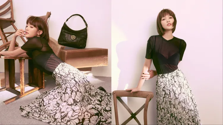 王淨以黑色薄紗透膚上衣、Bra Top搭配印花百褶裙。翻攝王淨IG