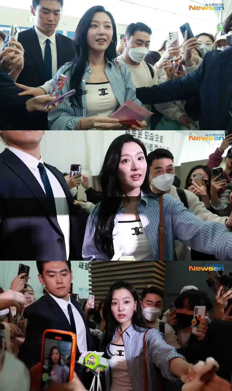金智媛被大批粉絲包圍沒有動氣，暖心收信、合比愛心，不忘提醒粉絲要注意安全。翻攝Newsen YouTube