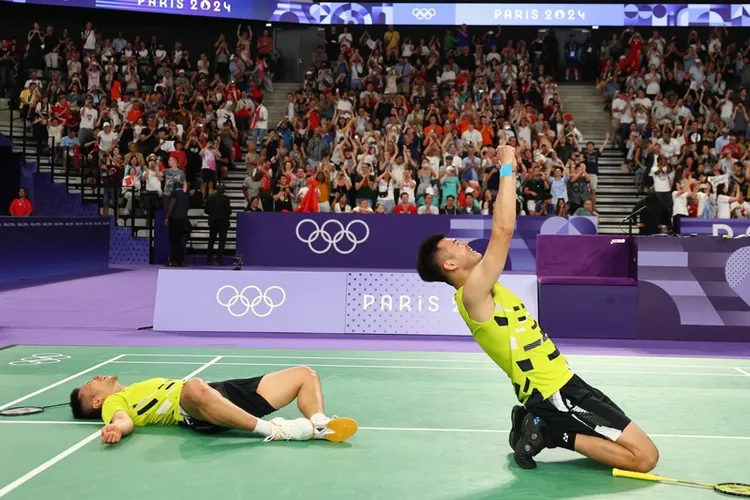 「麟洋配」寫下兩屆奧運12連勝驚人紀錄。中央社