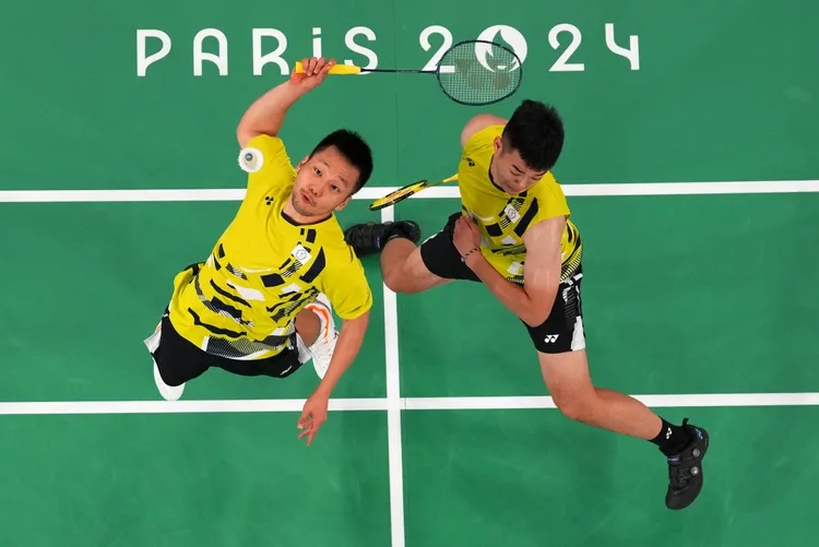 李洋（左）、王齊麟在奧運場上展現專注與強大的意志力。美聯社