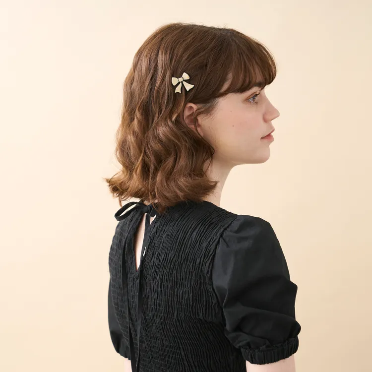 甜甜蝴蝶結豆扣夾（小），3300元。品牌提供