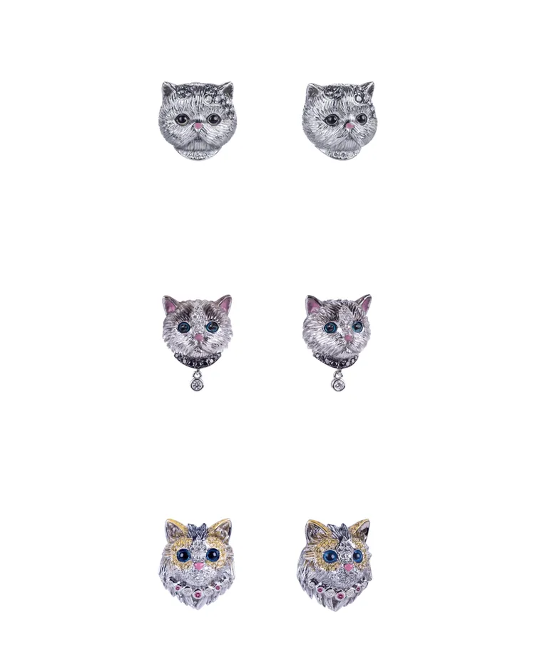 迷你加菲貓造型彩鑽單邊耳環（上）9萬元、迷你布偶貓造型黑鑽單邊耳環（中）9萬1500元、迷你波斯貓造型粉剛單邊耳環（下）11萬2500元。品牌提供