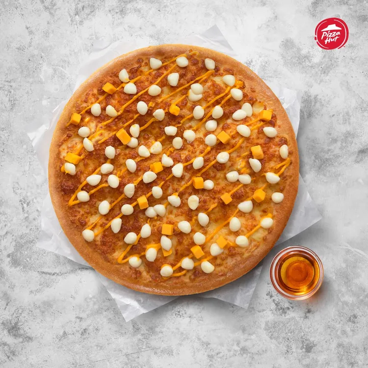 期間限定口味「起司狂熱大比薩」只要34折。必勝客提供