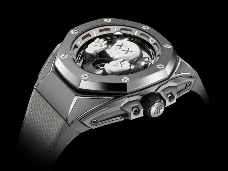 AP Royal Oak Concept皇家橡樹概念系列陀飛輪
「COMPANION」限量版腕錶，43mm，微珠噴砂鈦金屬錶殼，太陽紋裝飾圖案鈦金屬錶面橋板（設KAWS設計的灰色色調迷你鈦金COMPANION），易換式淺灰色小牛皮織紋錶帶，2979手動上鍊機芯，動力儲存72小時，防水深度100米，限量250只。品牌提供
