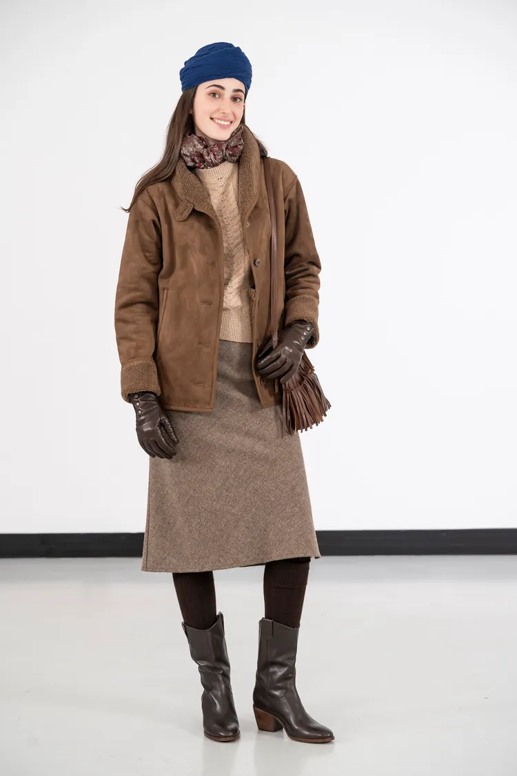 羊駝毛衣背心飾以細膩的針織緹花圖樣。品牌提供