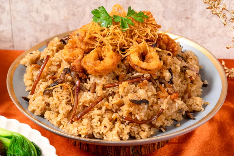 醬香墨魚糯米飯把經典油飯搭配大量新鮮墨魚，口感再升級。業者提供