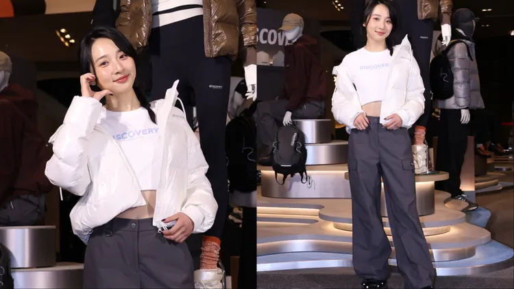 李沐換上Discovery Expedition OLLIA女版連帽羽絨外套搭配灰色工裝風長褲。莊宗達攝