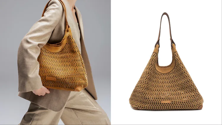 以鏤空雕花點綴的Dua麂皮雕花手提包呈現迷人光影效果，2萬5800元。品牌提供