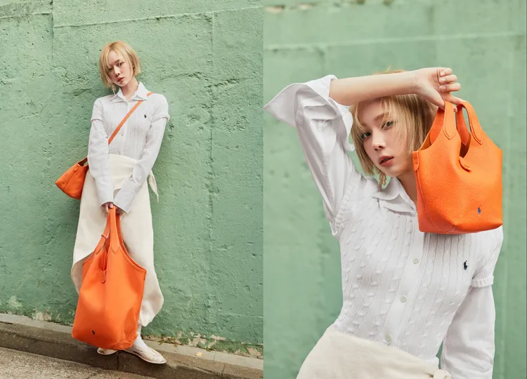 Winter以橘色Polo Play包替全白穿搭點綴出視覺重點。品牌提供