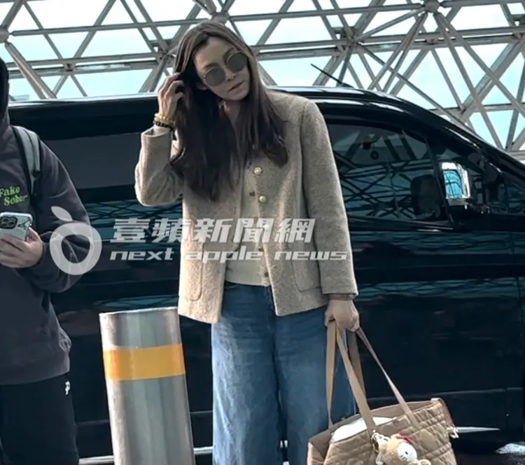 范瑋琪（右）戴上墨鏡後，整理飄逸秀髮。特勤中心攝