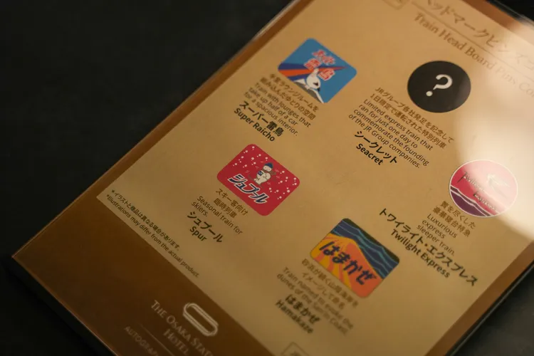 扭蛋內容為飯店原創設計徽章，圖樣取自那些從大阪發車的特急列車Logo。田欣雲攝影