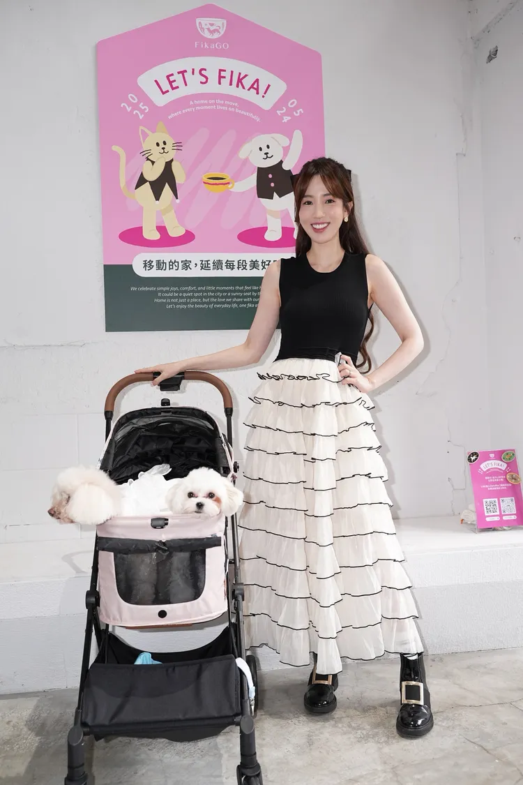 愛雅何時能生子，笑說要看養的2隻狗。彭欣偉攝