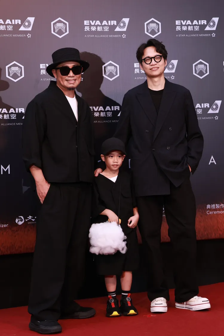 張淦勛（右）與高潮父子一起走紅毯。彭欣偉攝