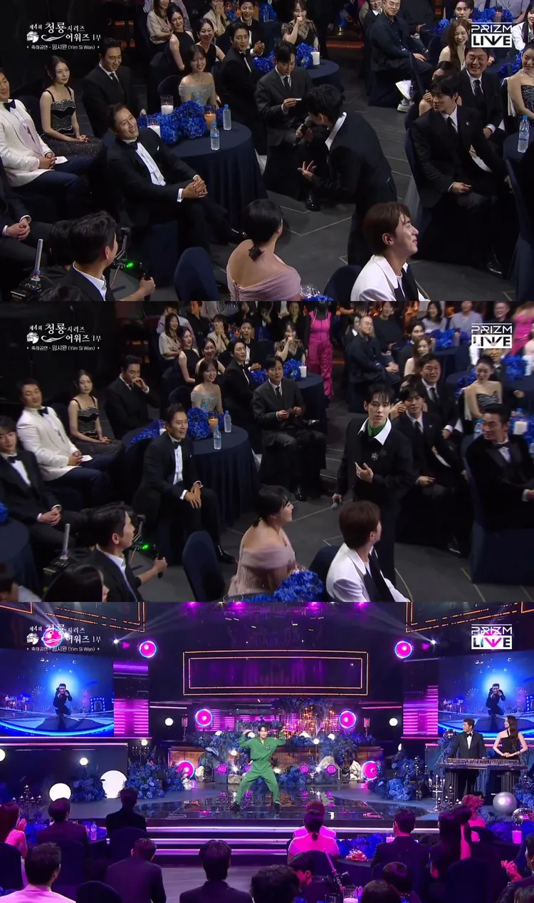 任時完場到一半下台，看到《魷魚遊戲》「遊戲負責人」李秉憲嚇了一跳，上台接受舞蹈挑戰。翻攝PRIZM