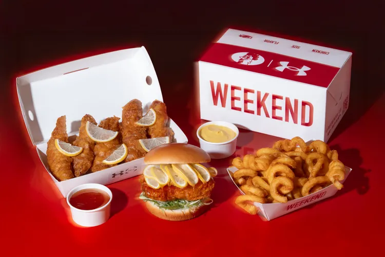 UNDER ARMOUR首度與「週末炸雞漢堡俱樂部大巨蛋店」推出聯名餐點。品牌提供