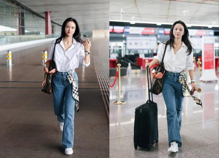 湯唯以襯衫搭配高腰小喇叭牛仔褲的簡約造型現身機場。品牌提供